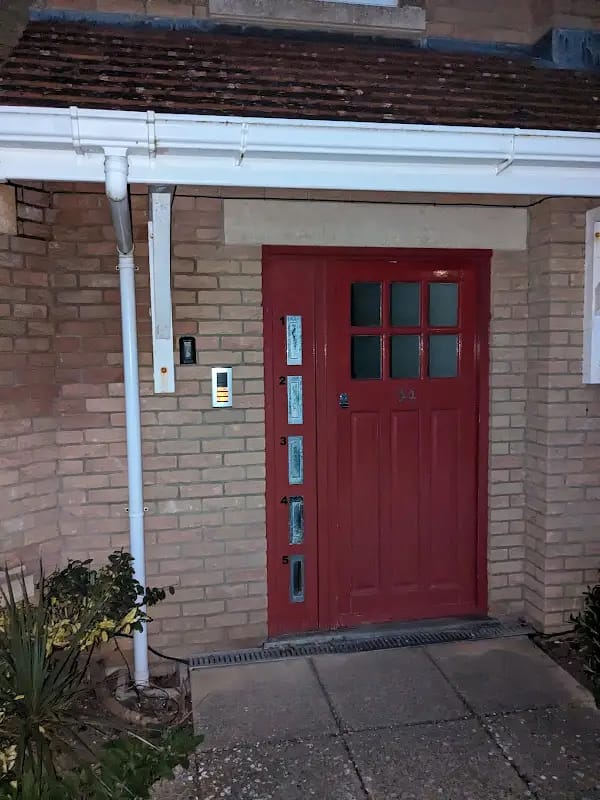 Front door professionally repainted in dark charcoal, Berkshire wood finishing